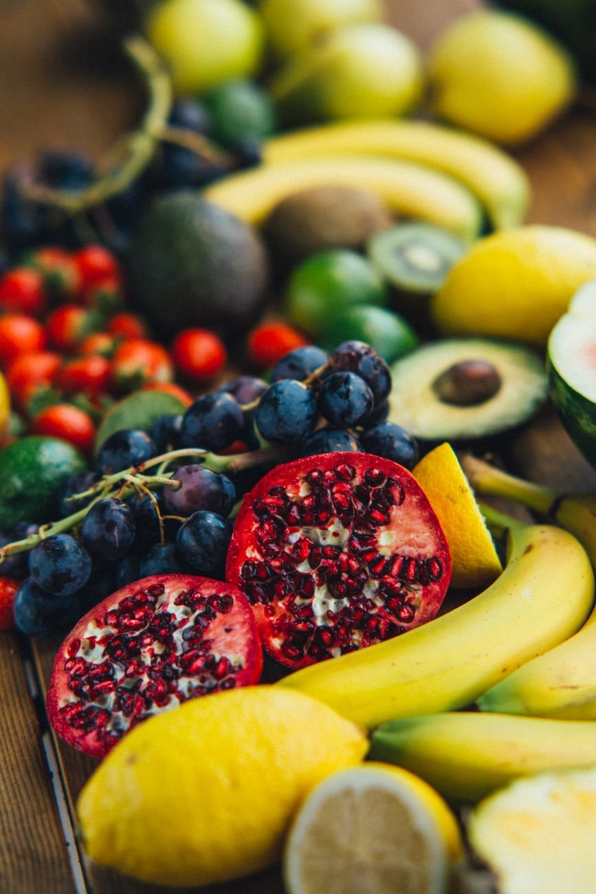 sliced fruits on wooden surface
